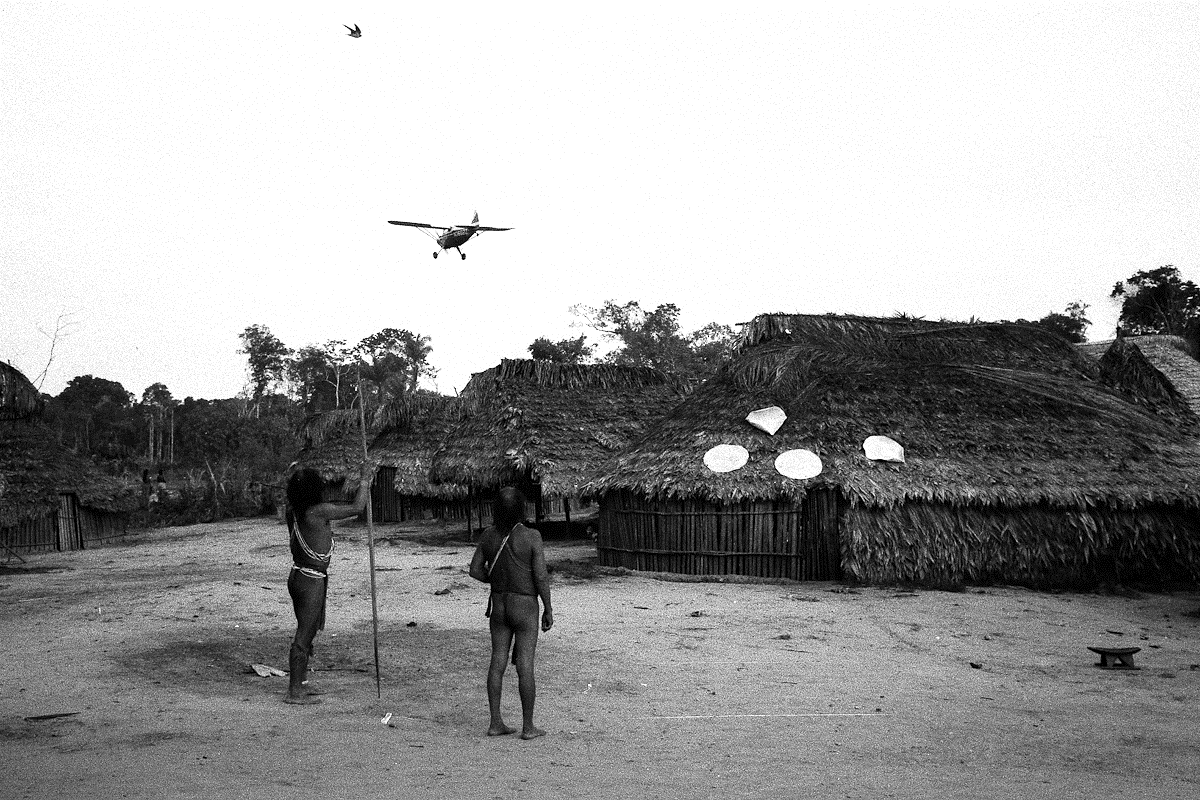 Copyright prm trio of men watching a missionary aircraft copyright prm trio of men watching a missionary aircraft